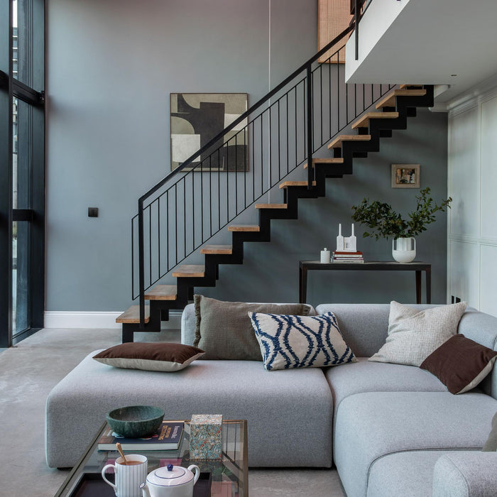 Contemporary living room featuring Lutron lighting control, illustrating an integrated smart home