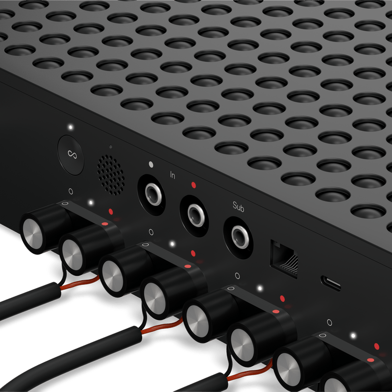 Close up of the Sonos Amp Multi rear panel with RCA inputs and subwoofer output connected